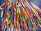 Tall ceiling hangings of colorful strips of assorted fabric