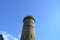 Tall cement tower structure with blue sky