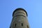 Tall cement tower structure with blue sky