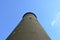 Tall cement tower structure with blue sky