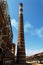 Tall chimney on fuel refinery factory