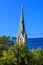 Tall church steeple against blue sky in downtown Raleigh