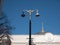 Tall city lantern with two security cameras in front of parliament government building in Kiev - Verkhovna Rada, Supreme Council