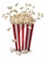 A tall classic box of theater popcorn popping up and scattered around on white background.