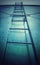 Tall commercial step ladder against the blue wall background