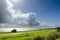 Tall cumulus clouds along the coast of lake IJsselmeer