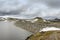 Tall dam in Norway made of huge heap of stones