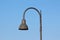 Tall dark grey modern public street lamp with LED light