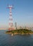 Tall electricity pylon in harbor of Xiamen China