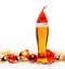 Tall glass of ale or beer with christmas red hat lights and baubles on white background