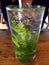 A Tall Glass of Mojito with Whole Mint Leaves and