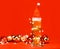 Tall glass of pale ale or beer with red santa hat christmas baubles and lights - cristmas drink background