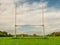 Tall goal post on training pitch for Irish National sport camogie, hurling, rugby and Gaelic football Nobody. Cloudy sky. Popular