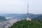 Tall lattice telecommunication tower on mountain