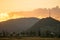 Tall lattice telecommunication tower at sunset