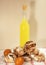 Tall lemon bottle, homemade French meringue with chocolate, chicken eggs. On a checkered kitchen towel