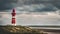 Tall lighthouse at the north sea under a cloudy sky