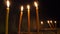 Tall long wax candles burn for repose. Memorial Day with candle. Commemorative candles. Candle flames burn in the