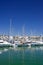 Tall luxury boats and yachts moored in Duquesa port in Spain on