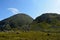 Tall majestic mountain in lush green summer