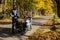 Tall male motorcyclist near gray Yamaha FJR motorcycle on the road in autumn. A beautiful Yamaha motorcycle on road. A