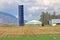 Tall Narrow Silo and Corn Field