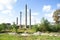 Tall old brick pipes of the former crystal factory against the blue sky. Destruction of the plant, decline, dismantling. Closing