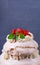 Tall Pavlova cake with whipped cream and strawberry