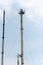 Tall pipe and mobile crane against the sky. Preparatory work for