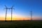 Tall power lines at dusk