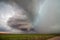 The tall, rotating updraft of a supercell thunderstorm towers over the plains in eastern Wyoming.