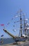 Tall ship decorated with maritime signal flags in New York harbor