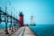 Tall ship sailing past a lighthouse on a summer day in South Haven