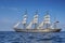 Tall Ship under sail with the shore