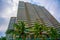 Tall skyscrapers, walkways and beautiful palm trees. Palm trees planted along the road, the tropics