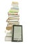 Tall stack of books and e-book reader