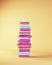 Tall Stack of School Books in Pink Purple Blue Beige Studying Back to School Concept Quarter View