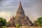 Tall Stupa Surrounded by Mini-Pagodas at Sunrise