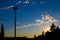 A Tall Telecommunications Tower At Sunset