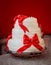 Tall three-tier cake, white with red bows