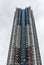 Tall tower of apartments along harbor of Hong Kong, China