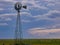 Tall Vintage Windmill Silhouetted with Beautiful Sky