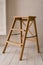 tall white bar stool legs are wood on gray background, Modern designer Bar chair