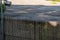 Tall wooden fence enclosure cage at nature reserve outdoors