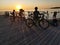 Tallinn, Estonia - 09.2019. silhouettes of a Bicycle against the sunset on the sea. Adults and children Cycling