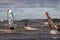 Tallinn, Estonia - October 18, 2008: Kitesurfer rides between windsurfers on the waves of the sea.