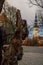 TALLINN, ESTONIA: St. Nicholas ` Church, Niguliste Church, Niguliste kirik. Old snag tree stump, beautiful autumn landscape in the