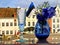 Tallinn old town hall square Estonia national flag  symbols of a blue bouquet cornflower in blue vase and glass of champagne on st