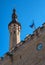 Tallinn Town Hall, Estonia. Fragment. Tower and flag of Estonia. Tallinn city Hall is an architectural monument of the