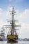 Tallship Etoile-du-Roy (France) is sailing at \'het IJ\' on his way to the shore.